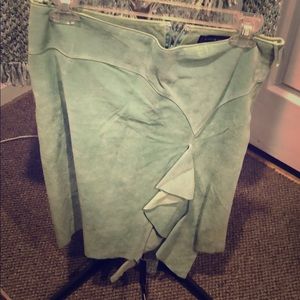 Teal green suede skirt goes with cardigan